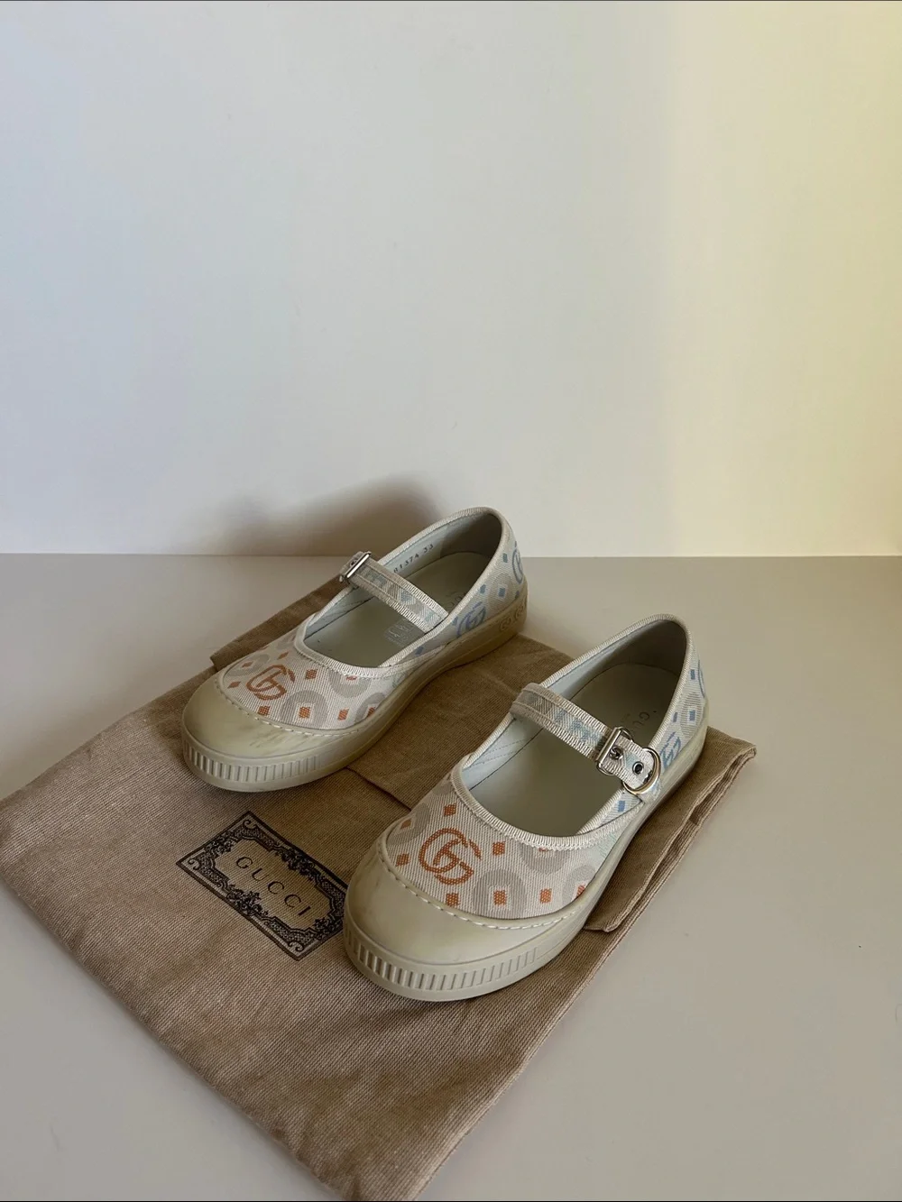 Gucci Ivory Canvas Mary Jane Flats with Pastel Logo Print